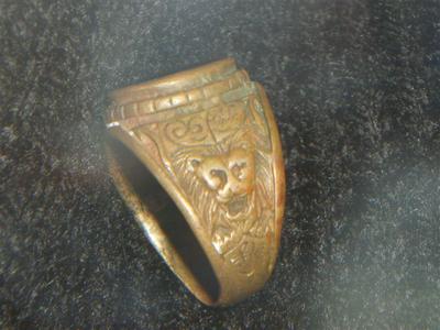 The ring shows red colour so could be bronze and other metal maybe