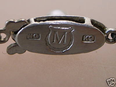 hallmarks on reverse of white gold clasp