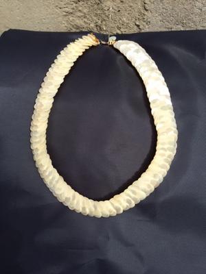 The Necklace which would sit at the base of the neck.