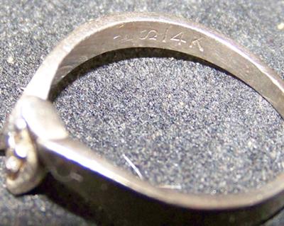You should be able to see the stamps in this photo (A Crown, sideways S and  then 14K).